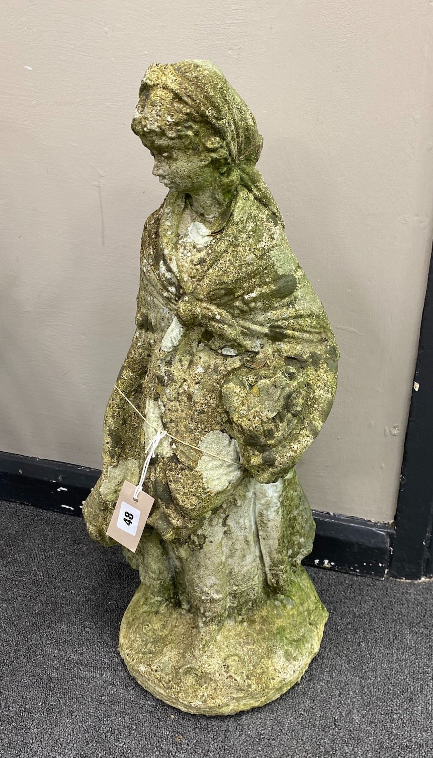 A reconstituted stone figural garden ornament, height 63cm